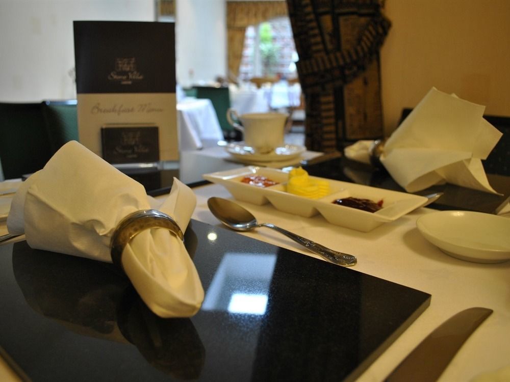 Stone Villa Chester Exterior foto A table set for afternoon tea at the Taj Mahal Palace, Mumbai, India